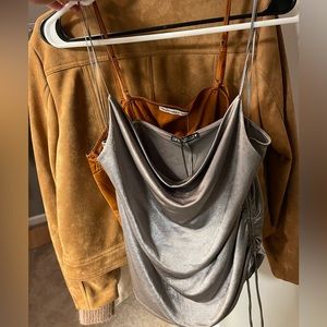 Silky silver spaghetti strap top. Perfect for a night out!